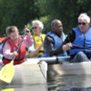 South Oxhey day service members paddling with oars in a boat.