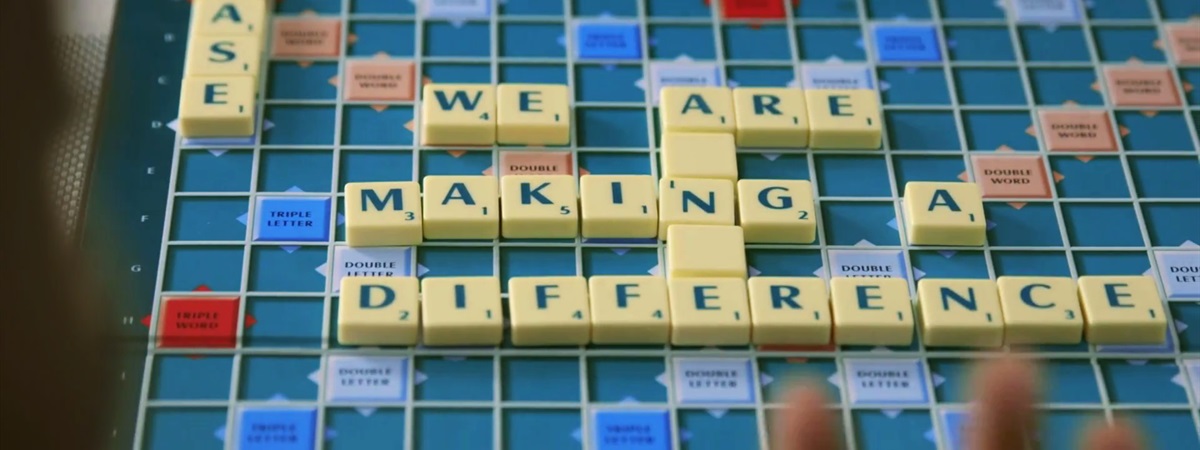 'We are making a difference' written in Scrabble letters.