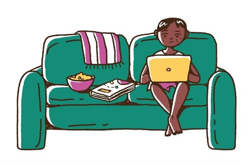 Parent using a laptop on their couch
