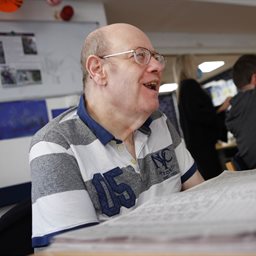 Older man laughing at a day service