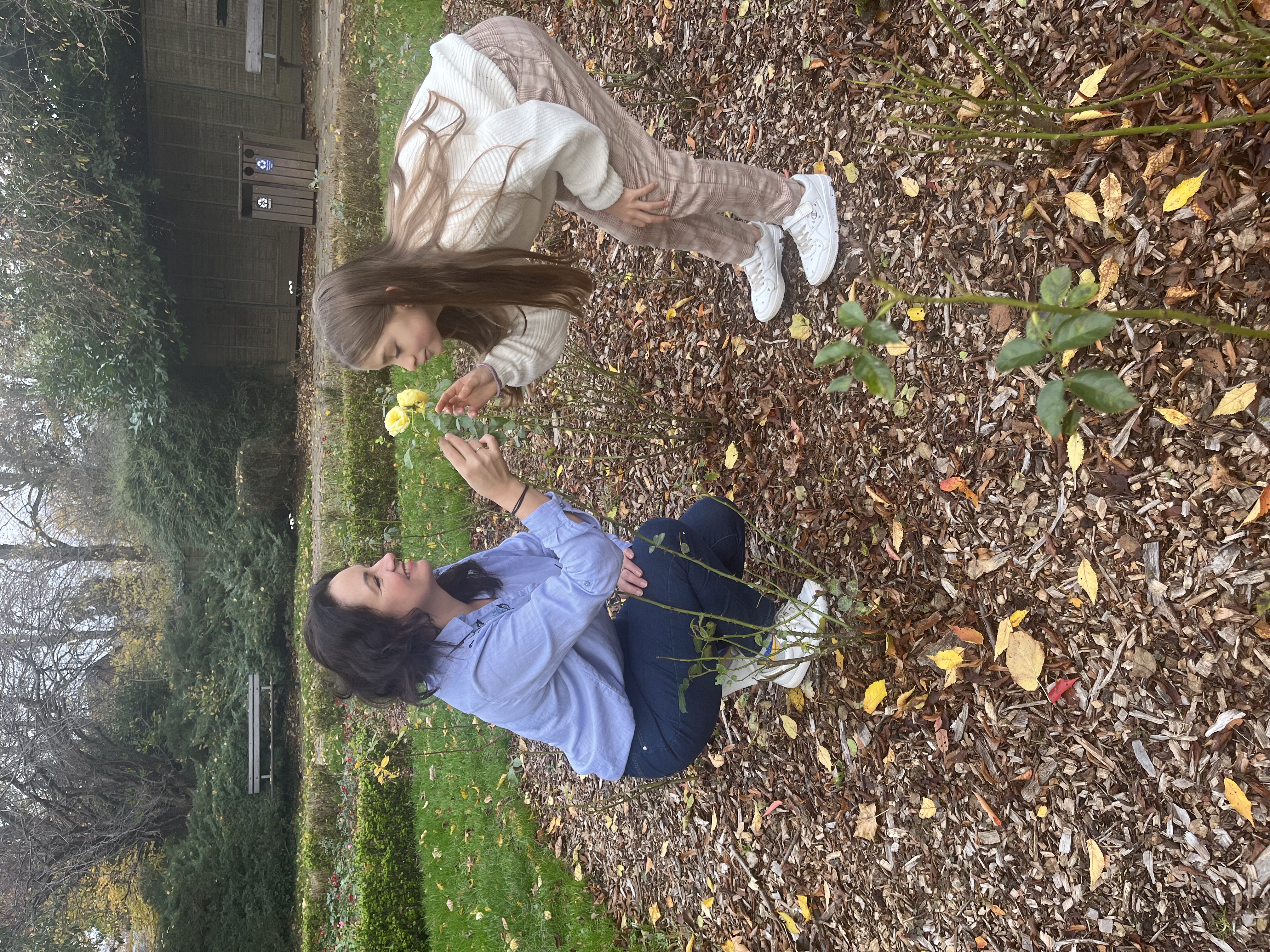 Adult playing a with a child with flowers