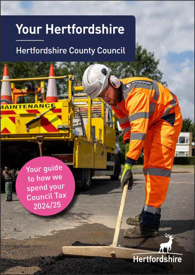 Your Hertfordshire front cover - roadworker using tarmac