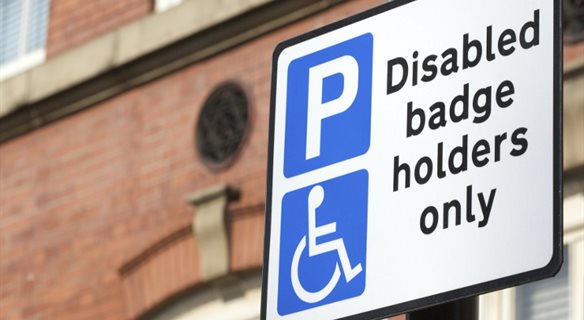 A picture of a "Disabled badge holders only" sign.