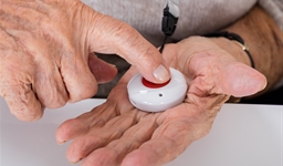 person pushing assistance pendant