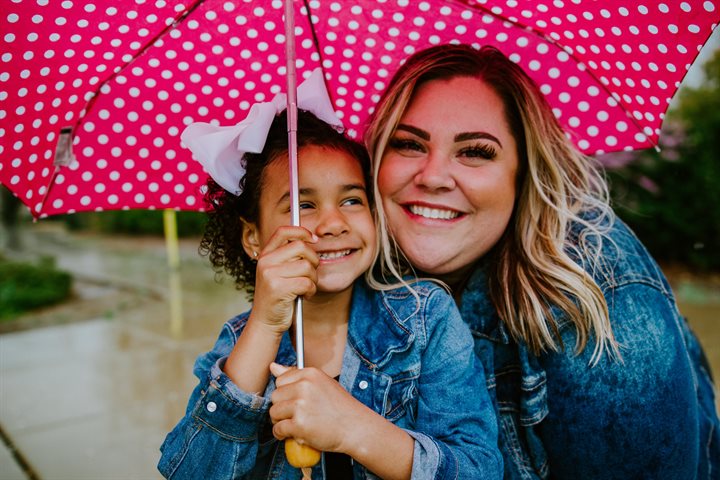 Foster carer with girl smiling