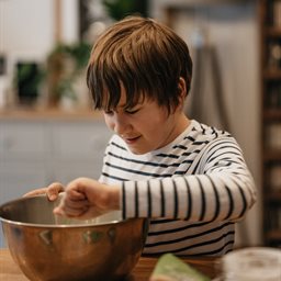 Boy stirring a mixing bowl