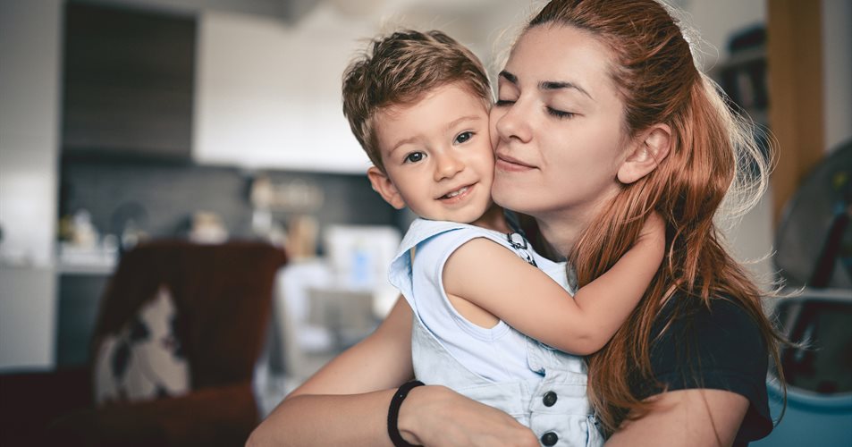 Woman hugging a little boy