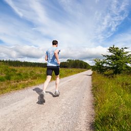 Man running along road