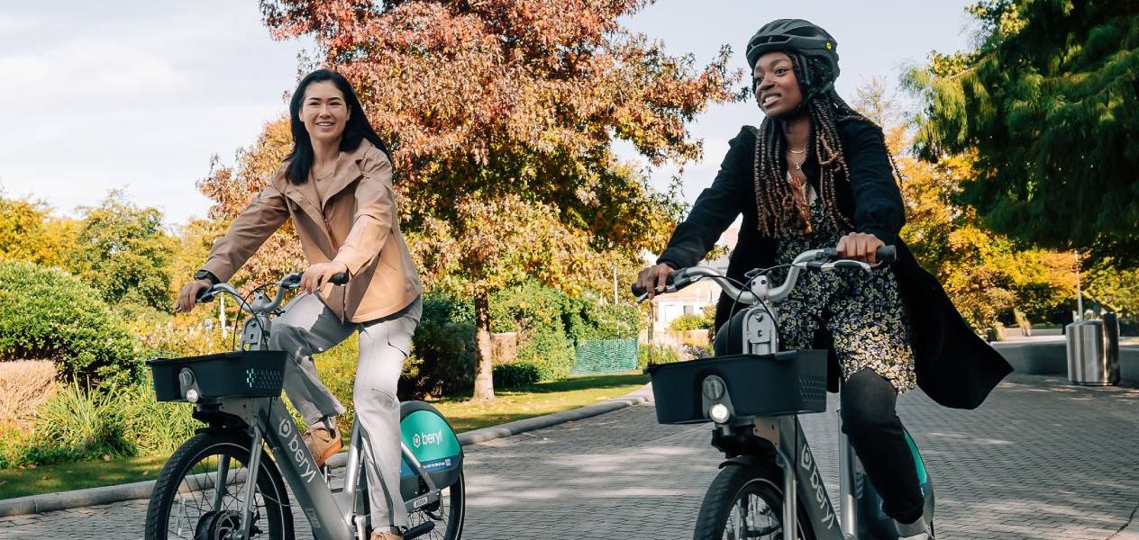 2 women riding on Beryl Bikes