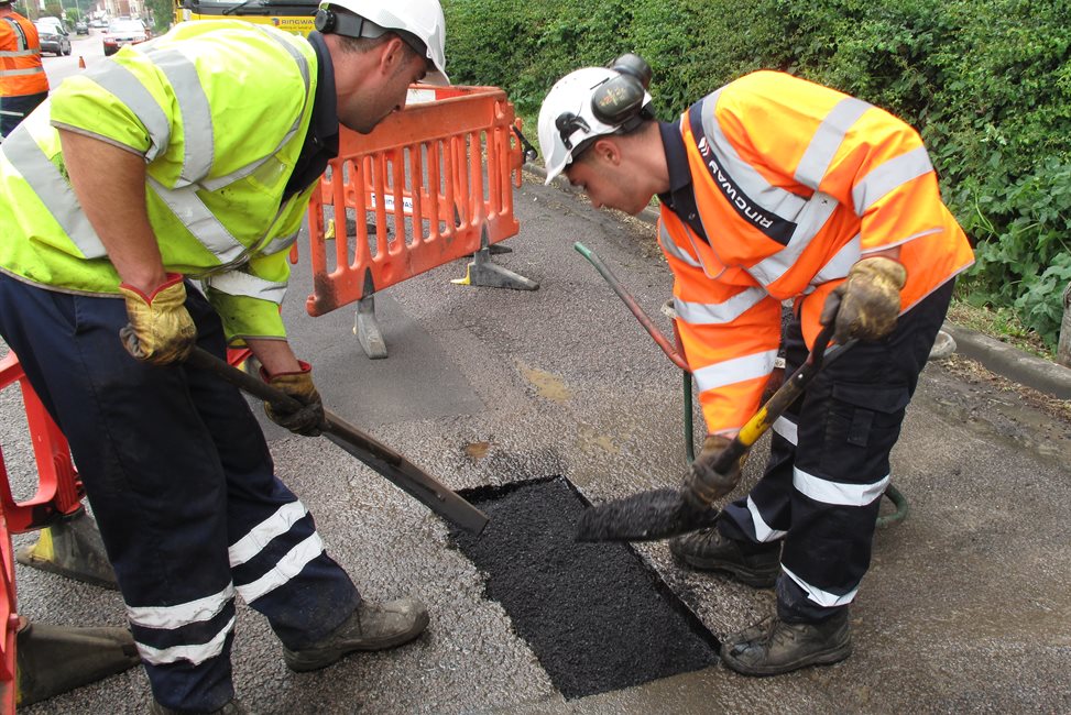 Engineers repairing a pothole