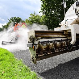 Engineers resurfacing a road