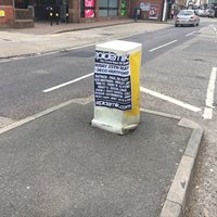 Illegal poster on a bollard