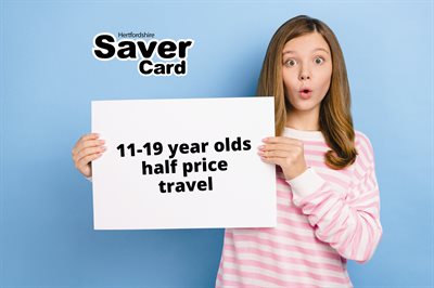 Woman holding a sign saying "11-19 year olds half price travel"