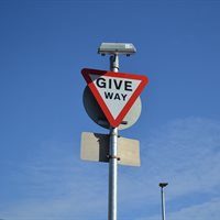 Sign lit giveway sign