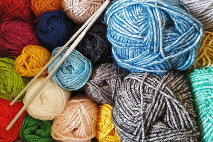 Colourful wool and knitting needles
