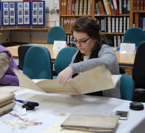 Woman searching through archive documents