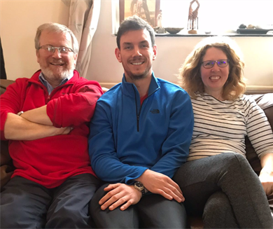 Thomas Anderson with his foster parents
