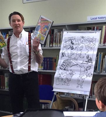 Litfest - Kev F Sutherland with comic cover at Rickmansworth Library