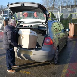 Man recycling cardboard