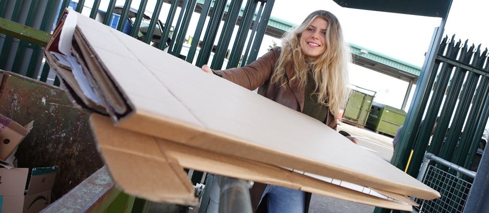 Woman recycling cardboard