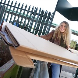 Woman recycling cardboard
