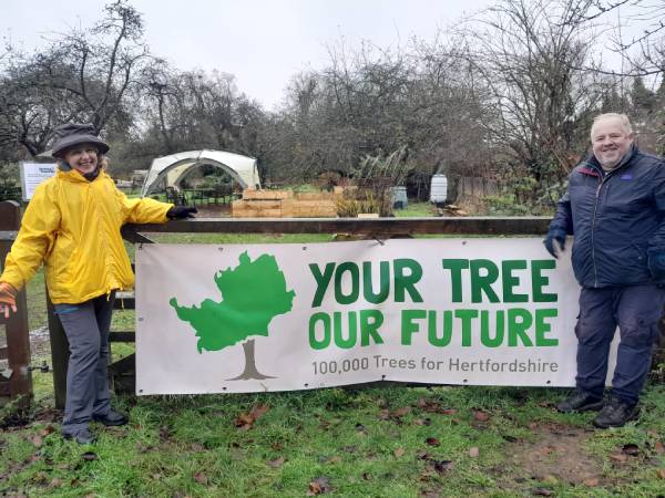 Your tree our future advocates standing with banner
