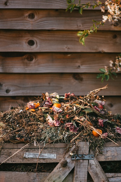 A homemade compost pile with garden and kitchen waste