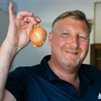 Man holding an onion