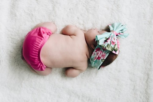 newborn with hair bow