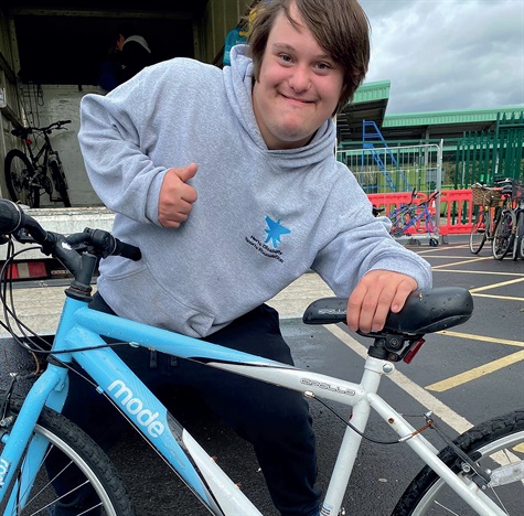 Herts Disability Sports Foundation rep with a donated bike