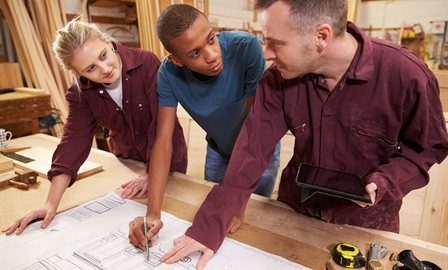 Carpenter teaching young people