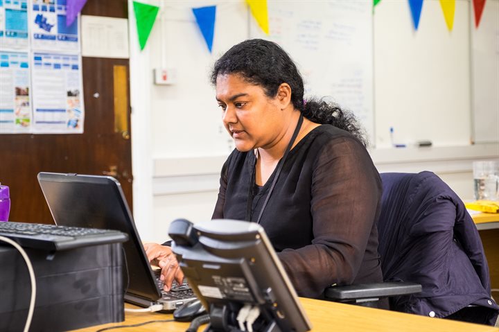 A woman working on a laptop