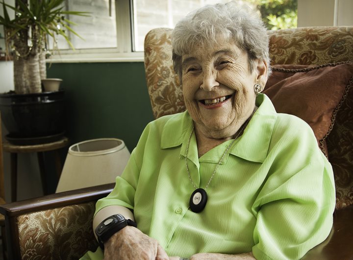 Lady smiling wearing a pendant
