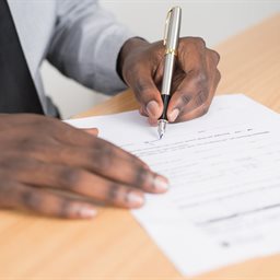 Man signing a document