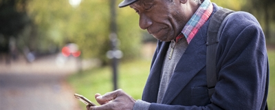 Man using a phone in a park