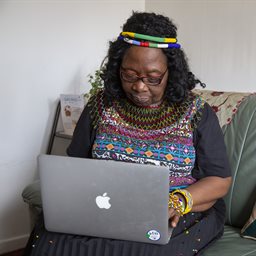 Older woman using a macbook