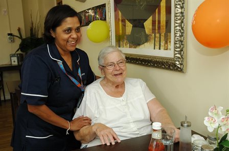 lady at table with carer