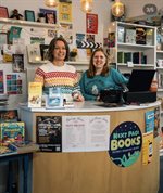 julie and liz behind the counter at Next Page books