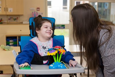 Girl at school with teacher